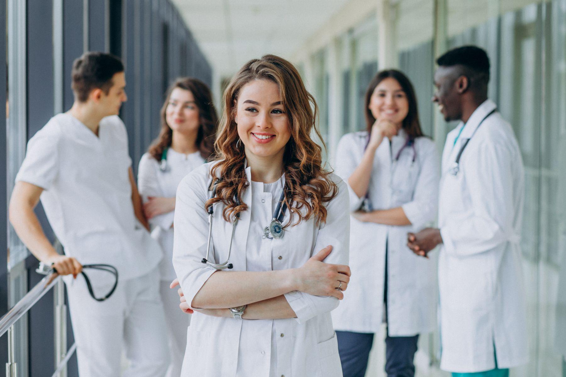 Young female doctor posing corridor hospital